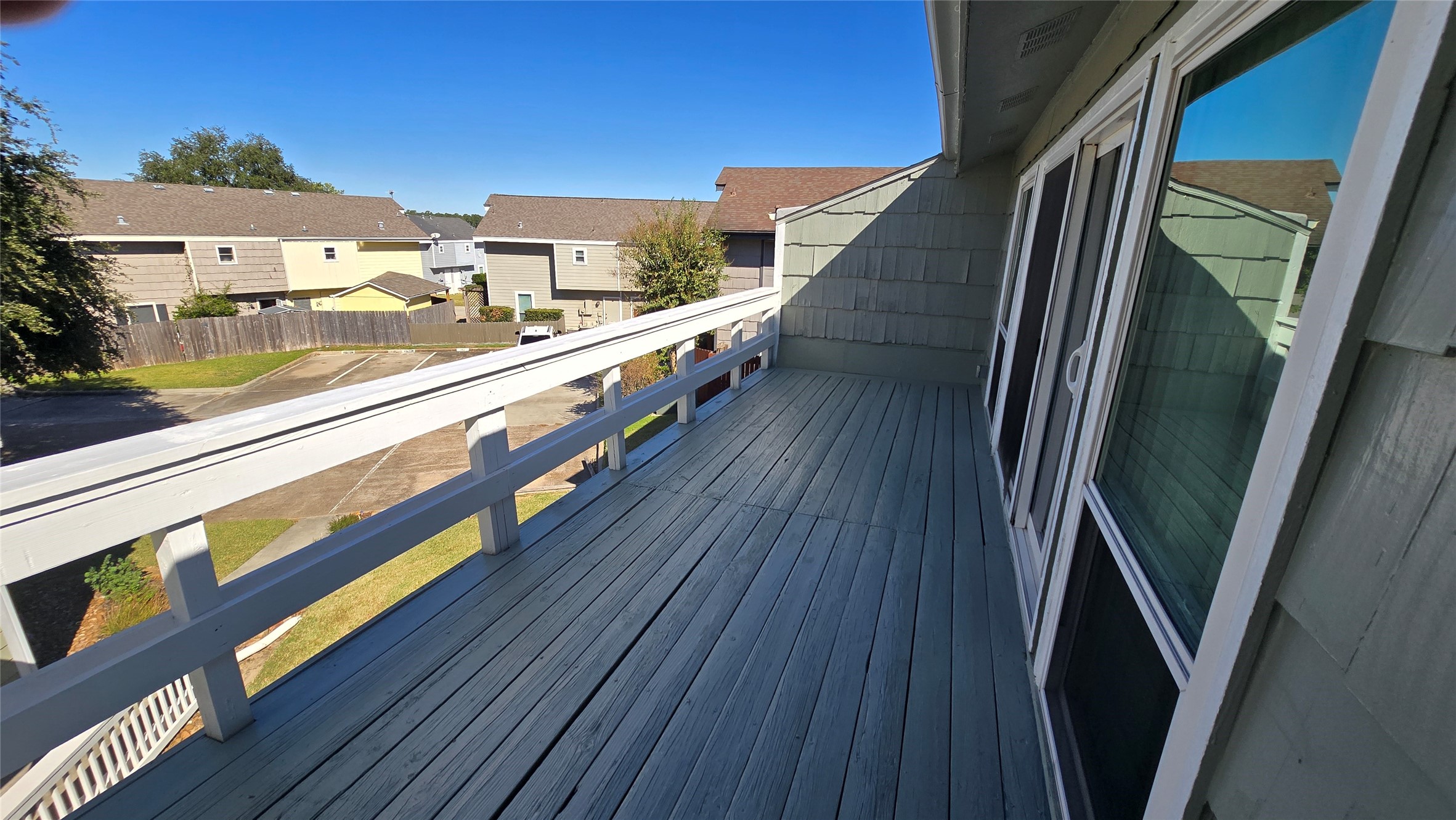 135 April Point Drive North Conroe, TX 77356 - Photo 28 of 28 a view of a balcony with wooden floor and fence