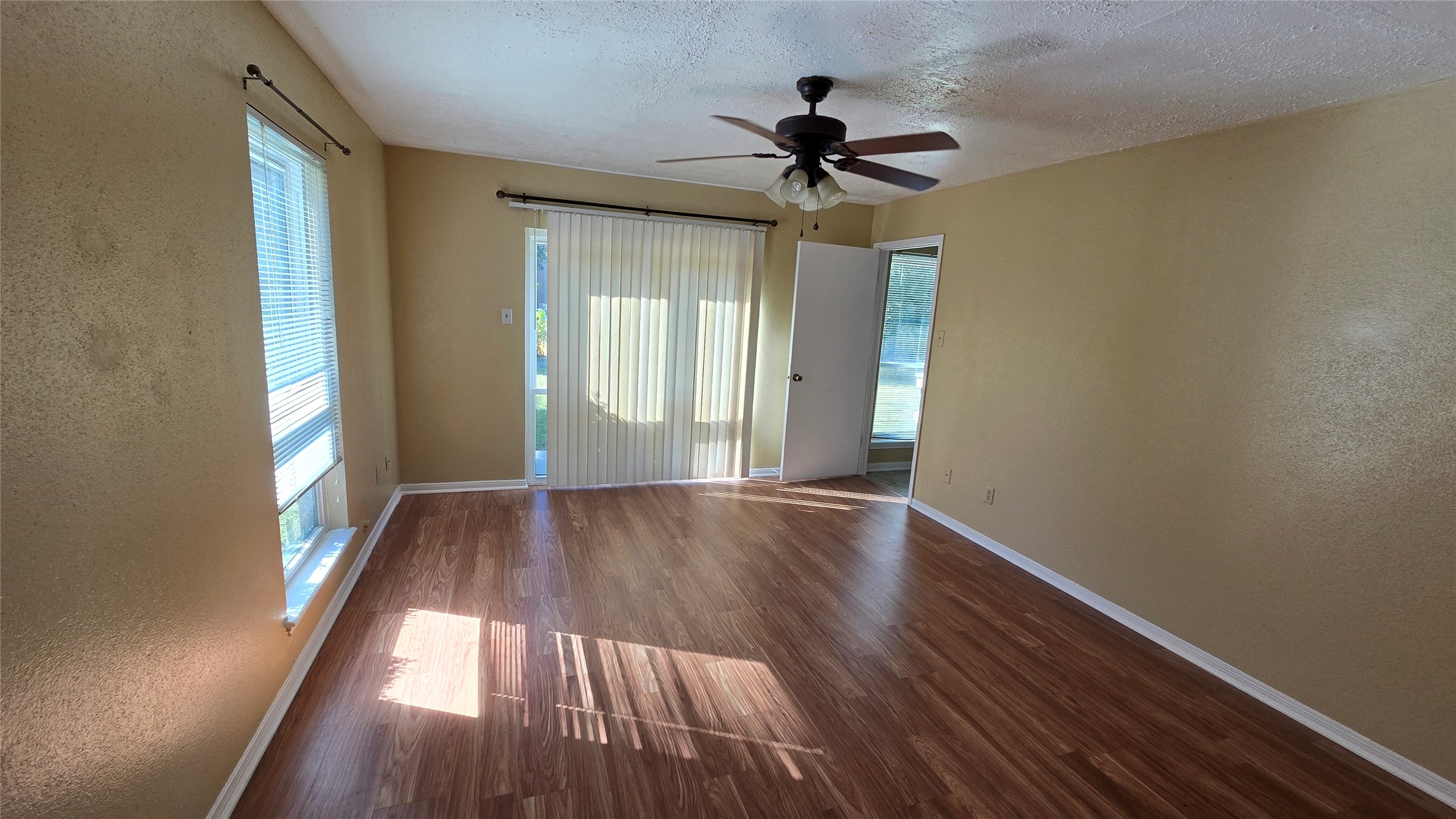 135 April Point Drive North Conroe, TX 77356 - Photo 7 of 28 a view of empty room with wooden floor and fan