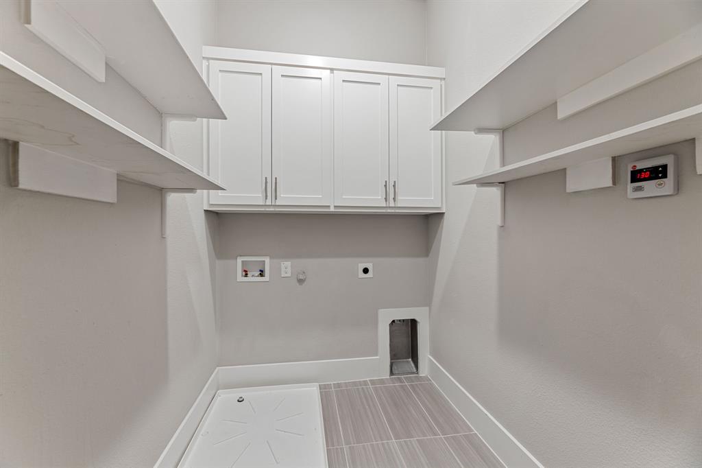 7854 Element Avenue Plano, TX 75024 - Photo 24 of 38 Laundry area with hookup for a gas dryer, electric dryer hookup, hookup for a washing machine, and cabinet space