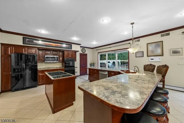 a view of a hallway with wooden floor and stairs