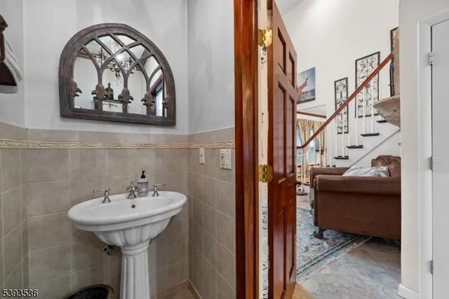 a bedroom with bed and a chandelier