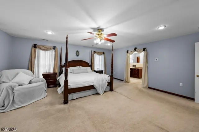 a en suite bathroom with a sink double vanity and a mirror