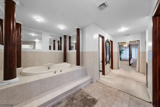 a view of a room with furniture and a ceiling fan