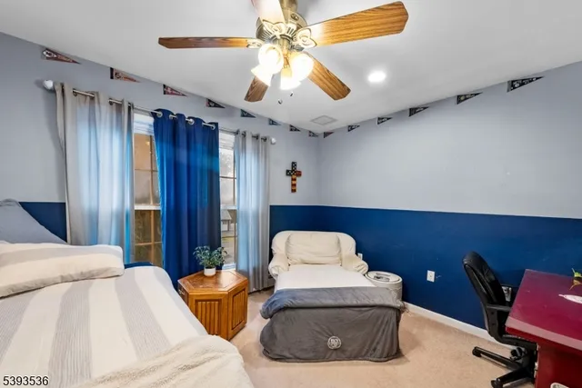 a view of a livingroom with furniture and a flat screen tv