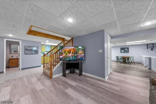 a front view of a house with a yard and trees