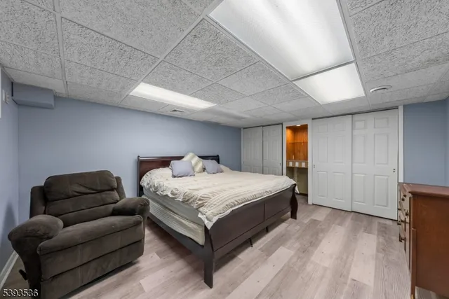 a view of a house with backyard and parking