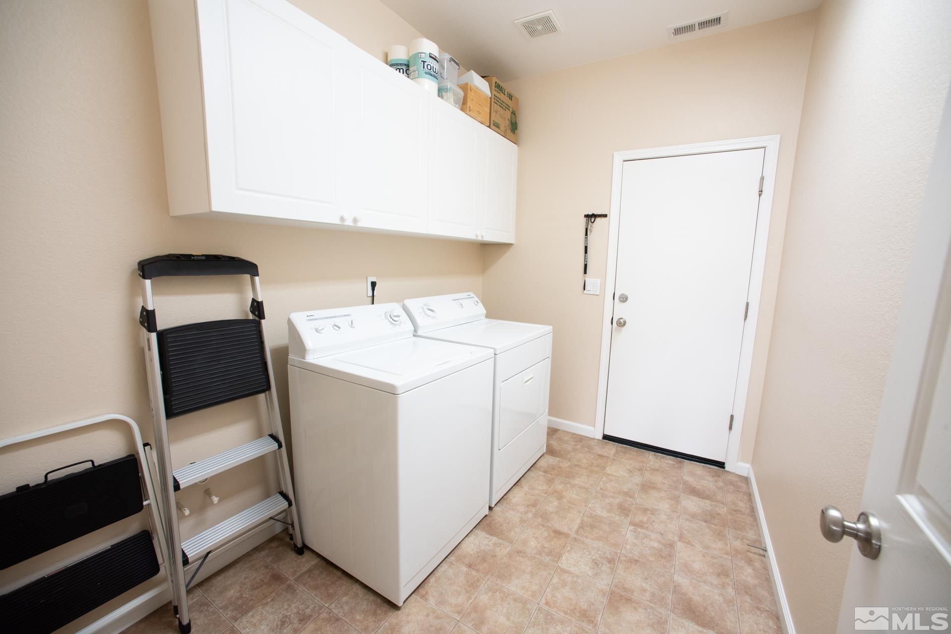 1798 Ornellaia Way Reno, NV 89521 - Photo 18 of 24 a utility room with dryer and washer
