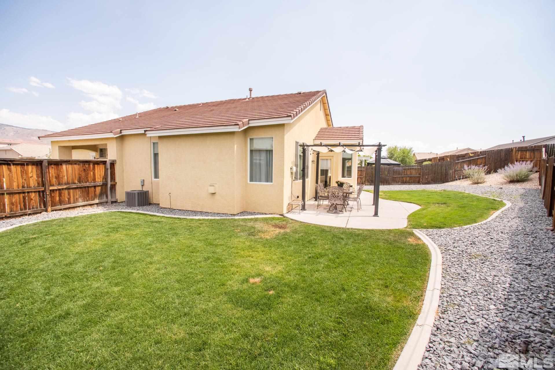 1798 Ornellaia Way Reno, NV 89521 - Photo 21 of 24 a view of a house with a yard and table