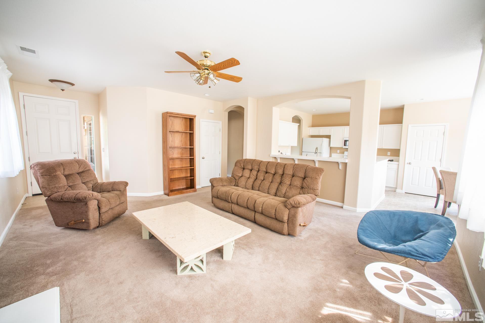 1798 Ornellaia Way Reno, NV 89521 - Photo 4 of 24 a living room with furniture and a large window