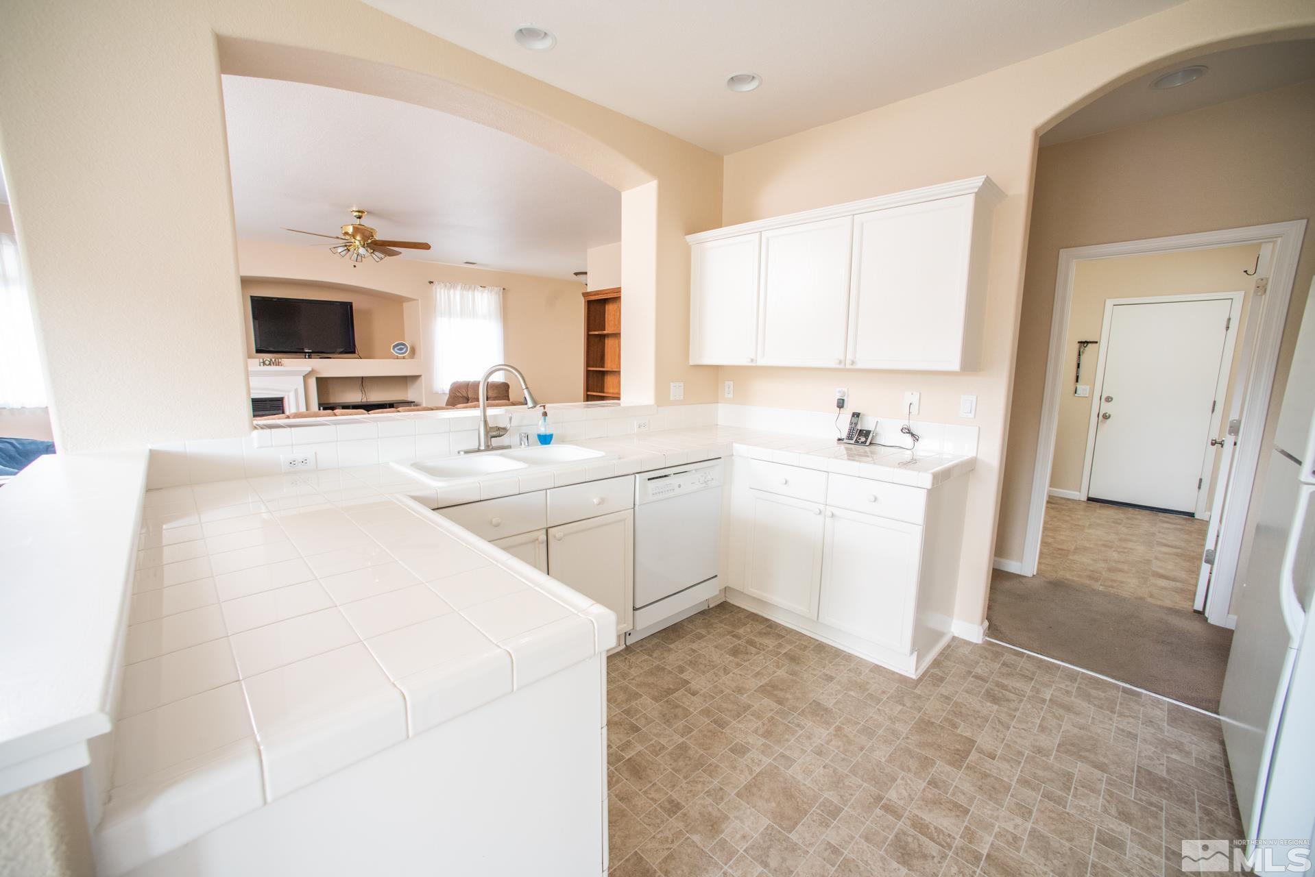 1798 Ornellaia Way Reno, NV 89521 - Photo 6 of 24 a room with a sink and a mirror