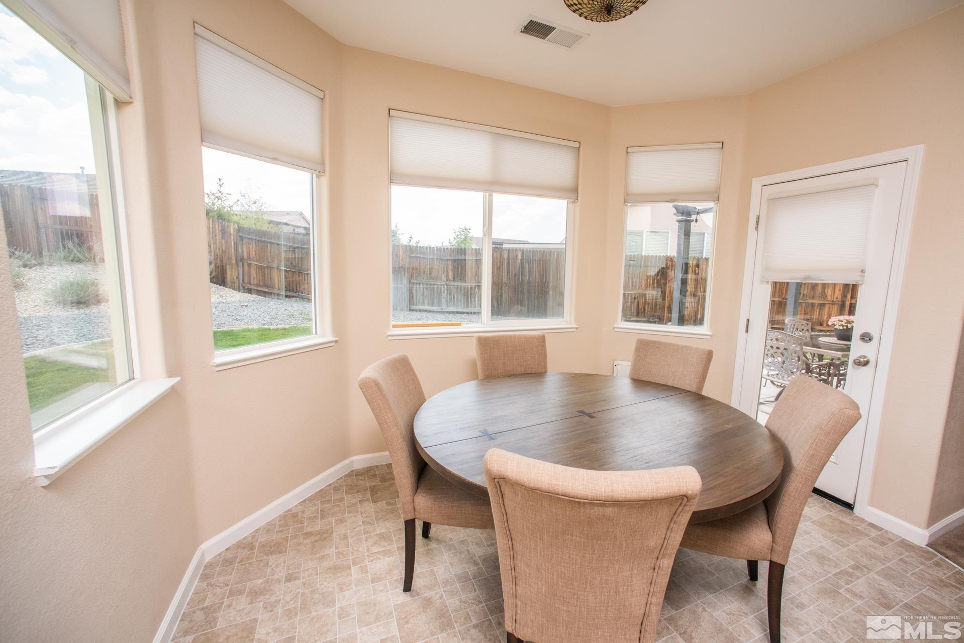 1798 Ornellaia Way Reno, NV 89521 - Photo 9 of 24 a dining room with furniture and window