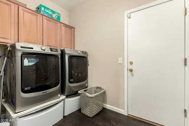 a utility room with dryer and washer