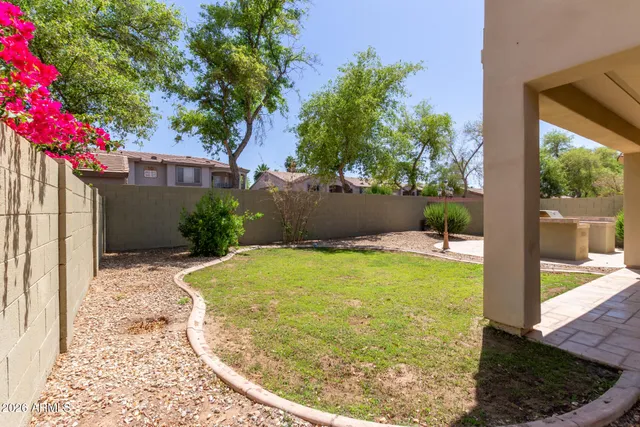 a view of a house with pool garden and patio