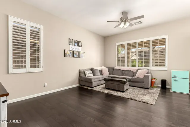 a living room with furniture and windows