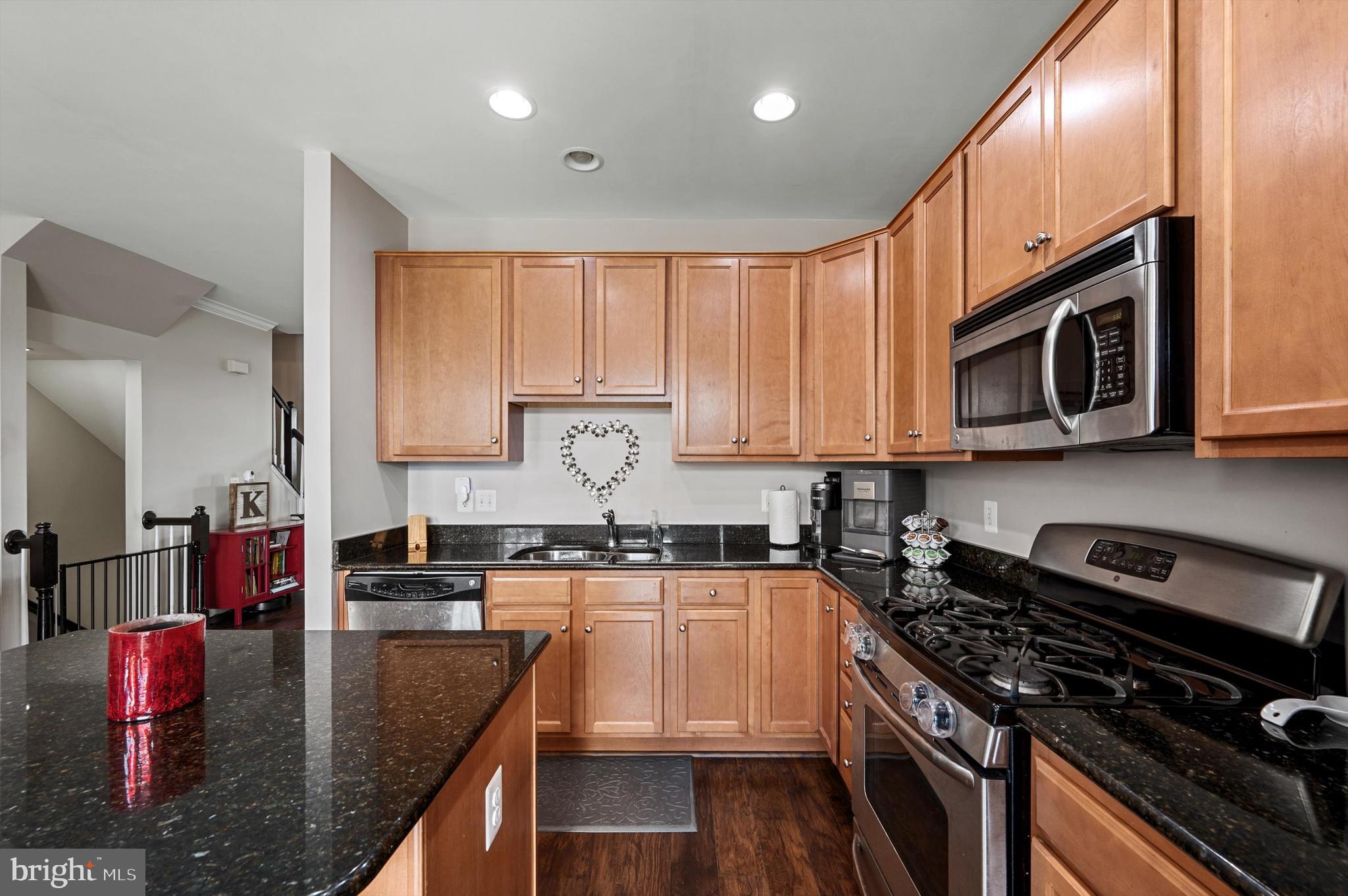 15 Driver Square Front Royal, VA 22630 - Photo 12 of 45 a kitchen with stainless steel appliances granite countertop a stove top oven a sink dishwasher and microwave oven