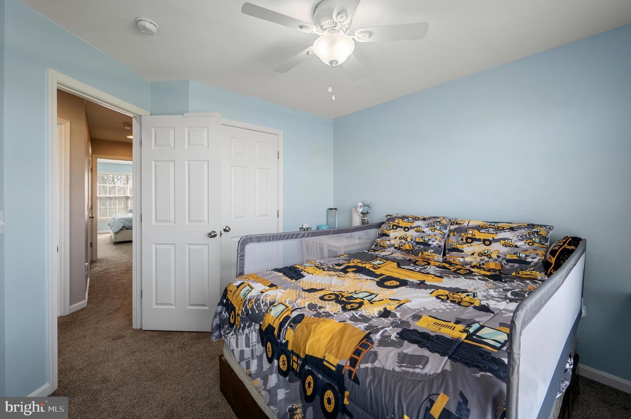 15 Driver Square Front Royal, VA 22630 - Photo 20 of 45 a bedroom with a bed and a chandelier