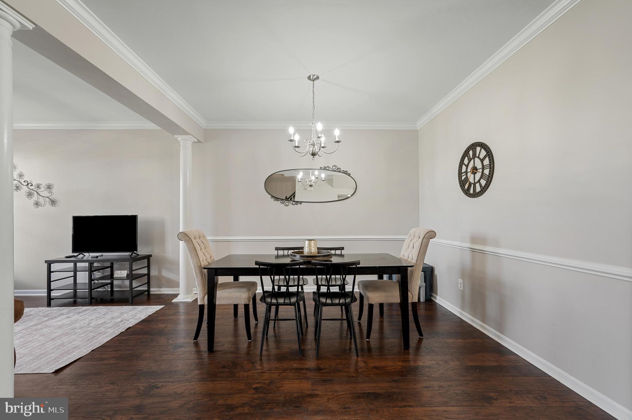 15 Driver Square Front Royal, VA 22630 - Photo 5 of 45 a view of a dining room with furniture wooden floor and a chandelier