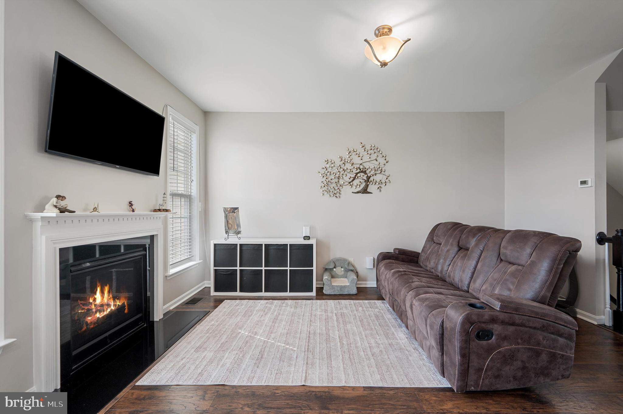 15 Driver Square Front Royal, VA 22630 - Photo 8 of 45 a living room with furniture a flat screen tv and a fireplace
