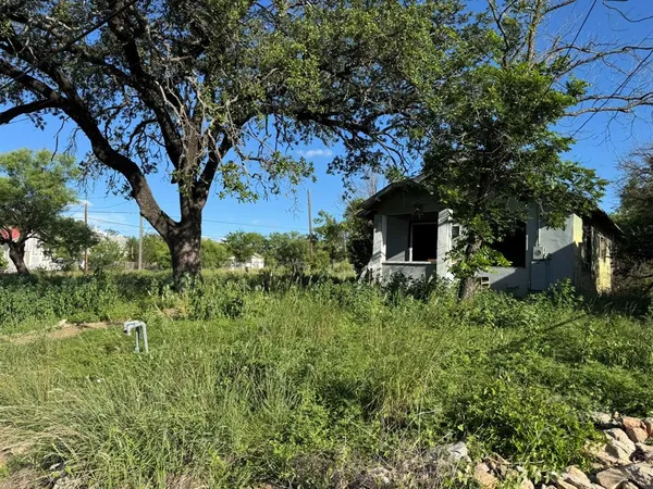 a view of a house with a tree