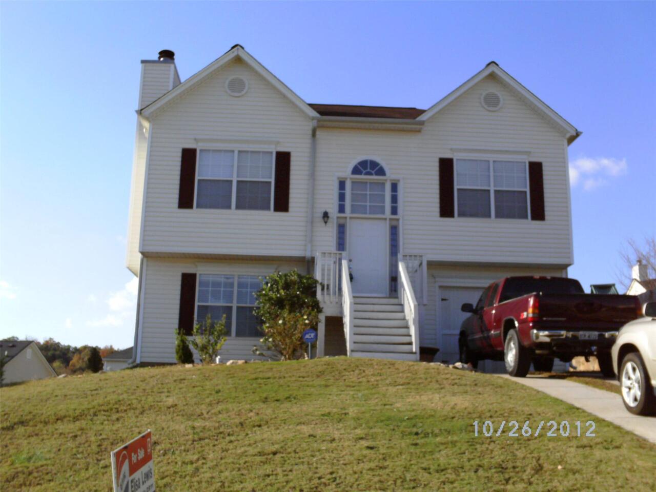 4425 Roche Street, Unit 89 College Park, GA 30349 - Photo 1 of 1 a front view of a house with parking area
