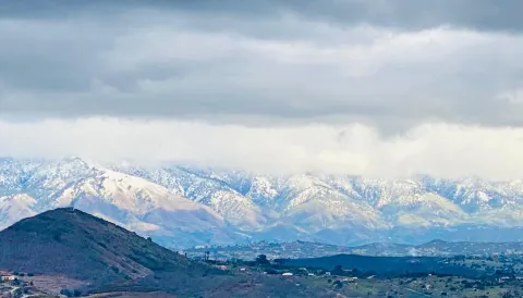 a view of a lake with mountains in the background