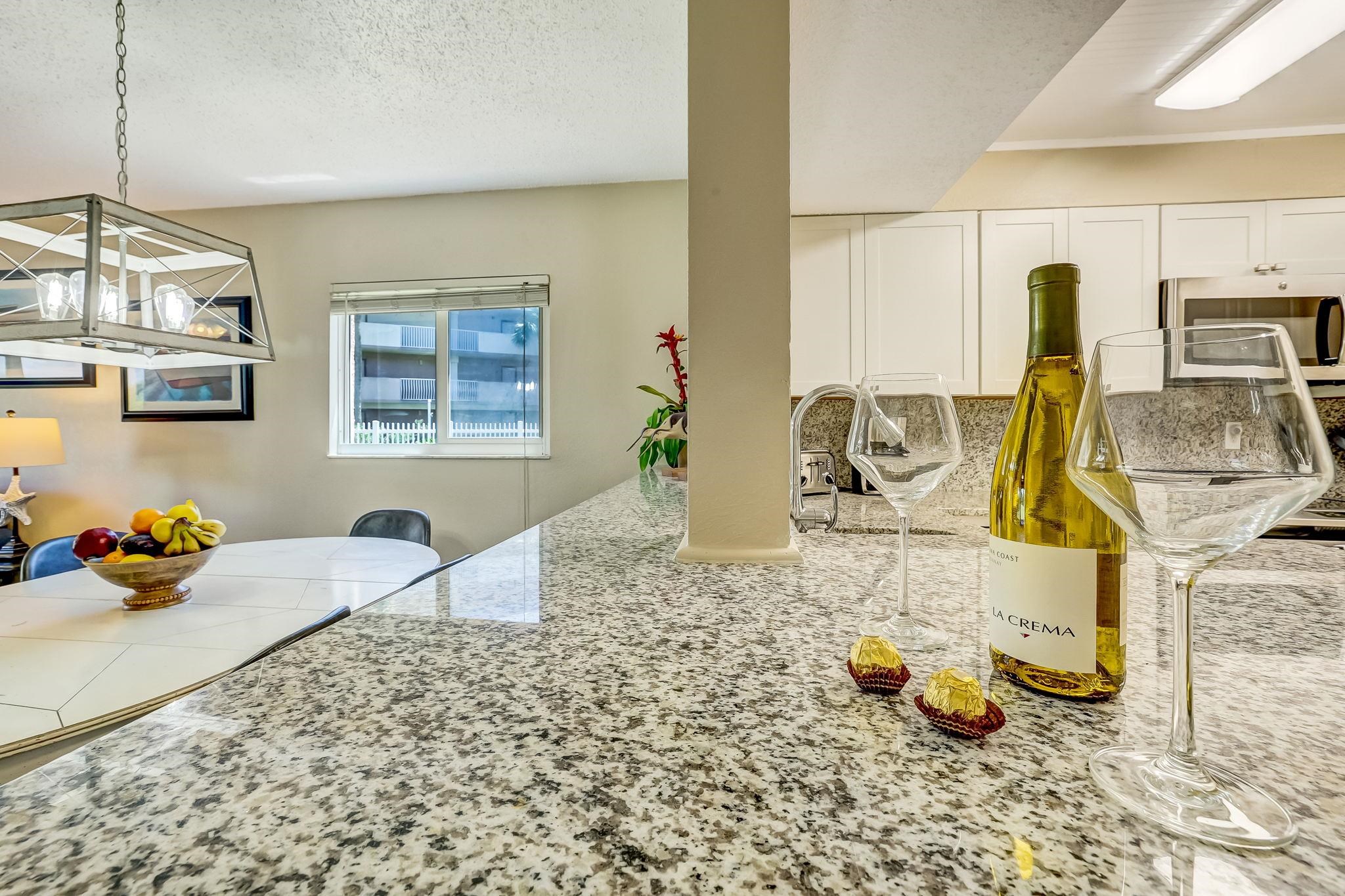4 Ocean Trace Road, Unit 108 St. Augustine, FL 32080 - Photo 14 of 54 a bedroom with furniture and a chandelier