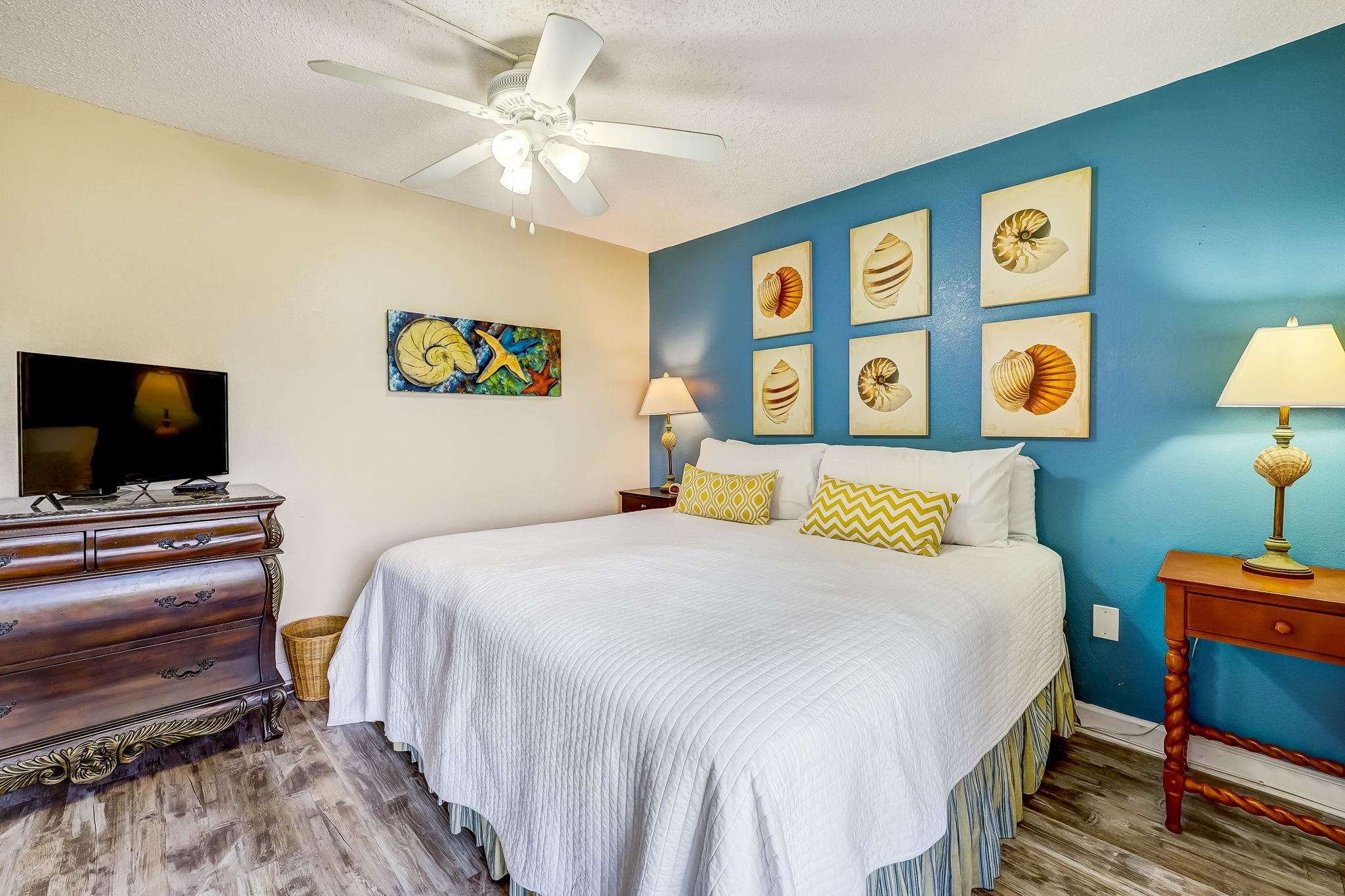 4 Ocean Trace Road, Unit 108 St. Augustine, FL 32080 - Photo 15 of 54 a bedroom with a bed and a flat screen tv