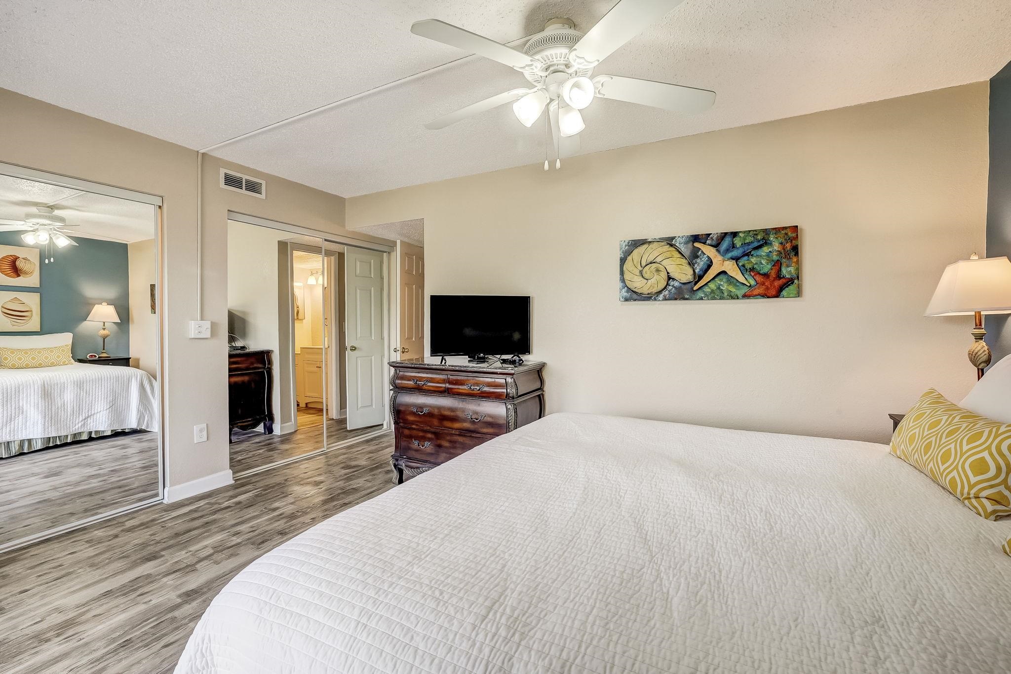 4 Ocean Trace Road, Unit 108 St. Augustine, FL 32080 - Photo 16 of 54 a bedroom with a bed and a flat screen tv