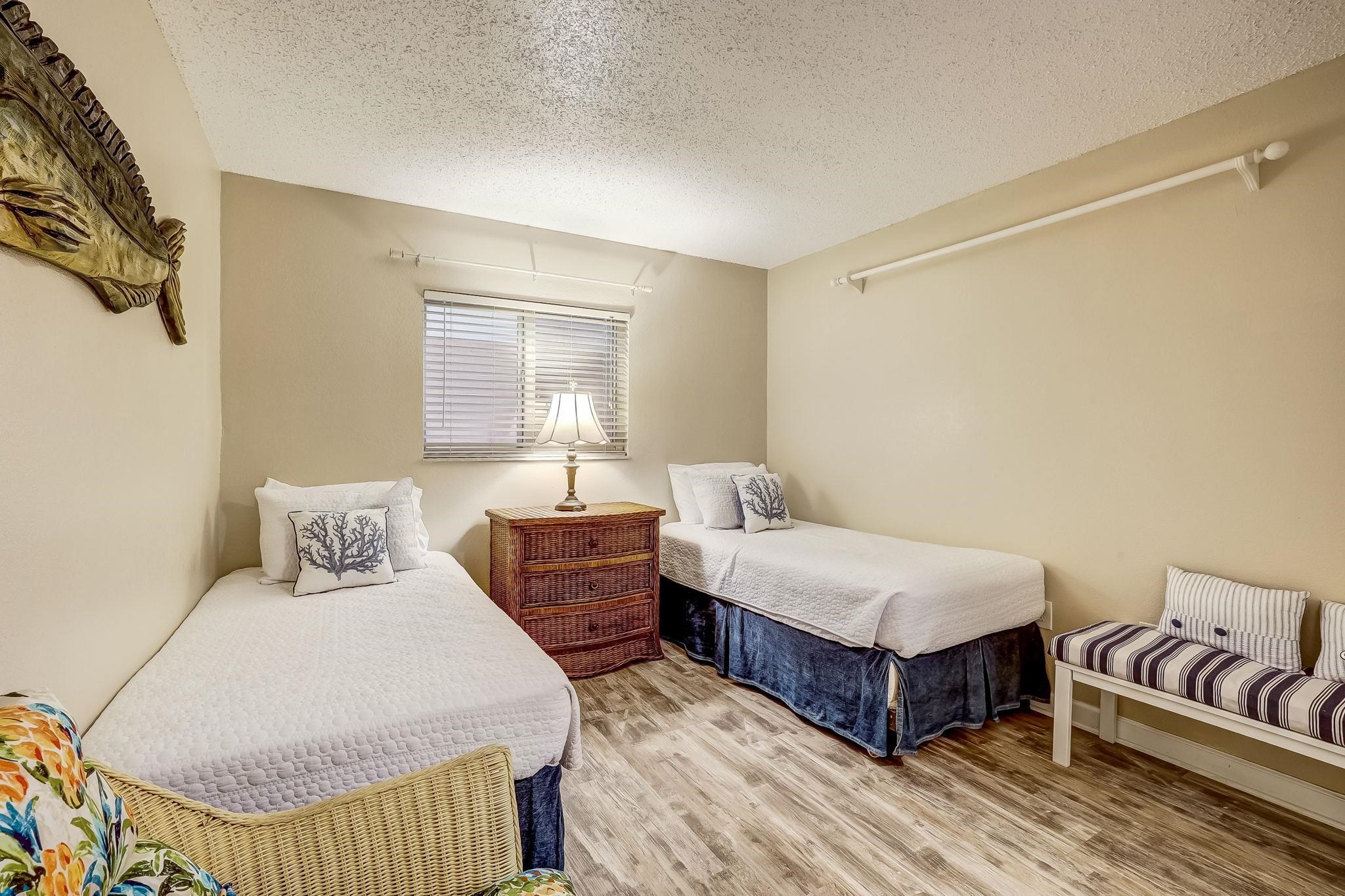 4 Ocean Trace Road, Unit 108 St. Augustine, FL 32080 - Photo 20 of 54 a bedroom with a bed and a couch