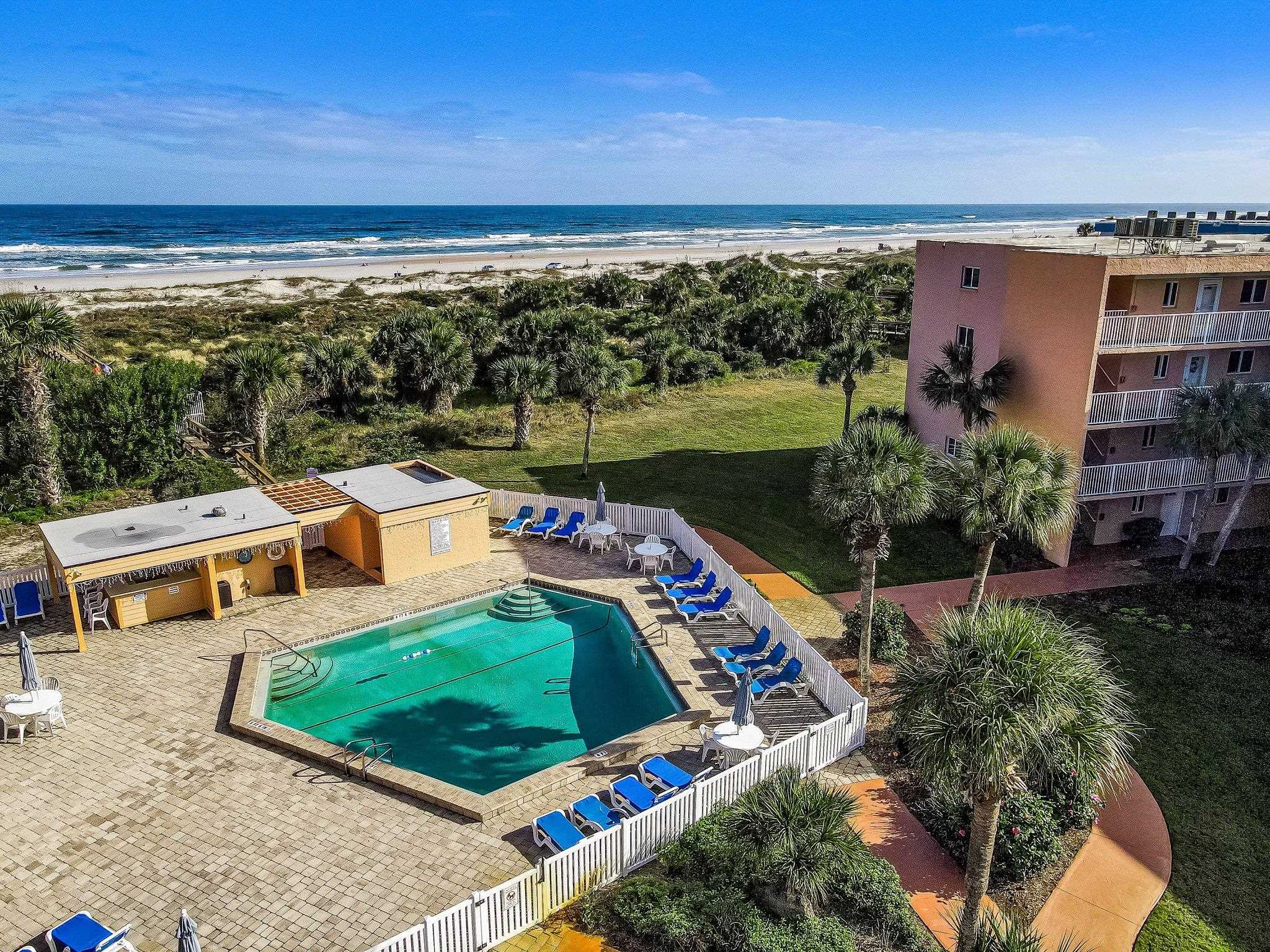 4 Ocean Trace Road, Unit 108 St. Augustine, FL 32080 - Photo 2 of 54 a view of a swimming pool with a patio