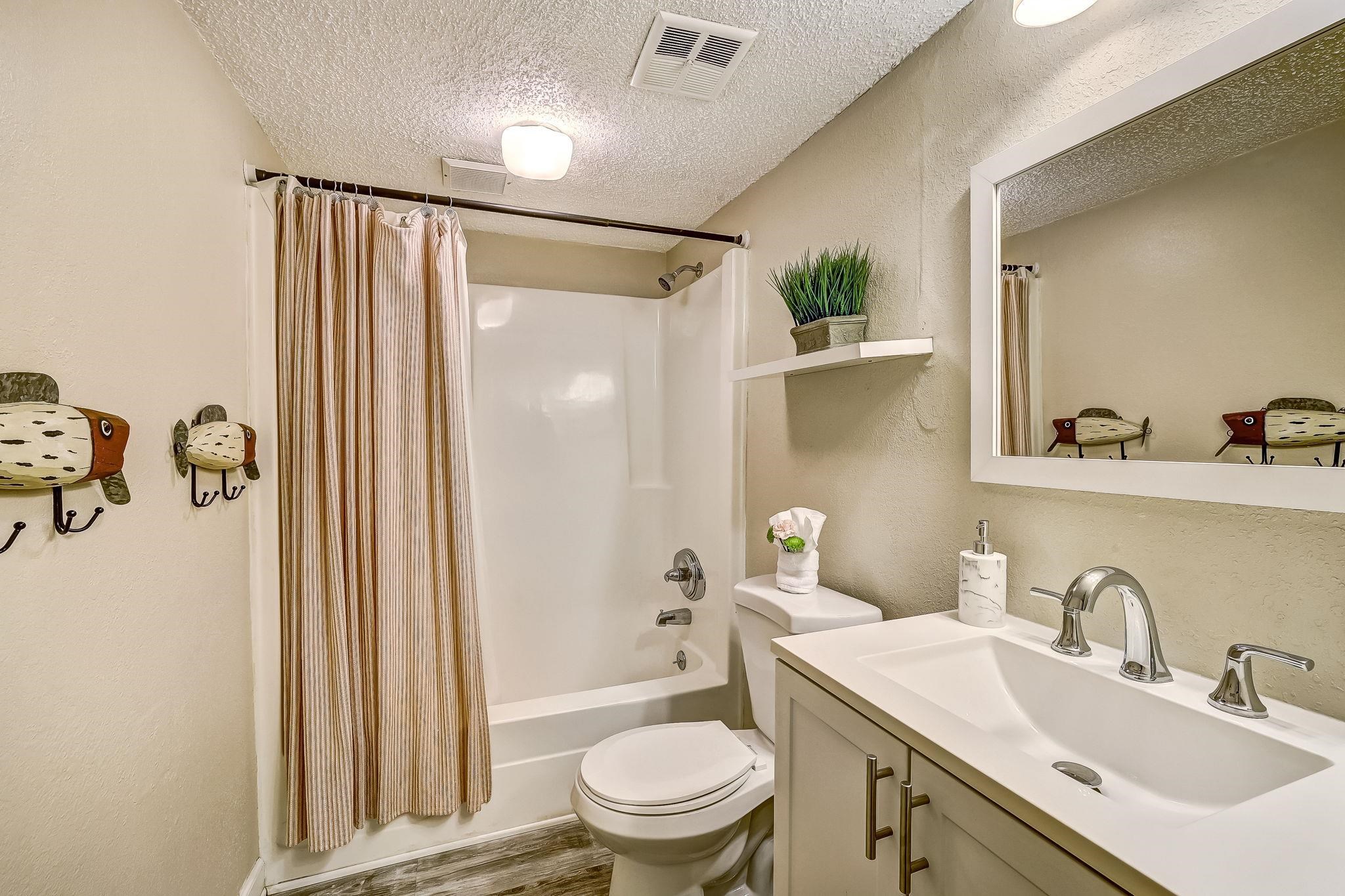 4 Ocean Trace Road, Unit 108 St. Augustine, FL 32080 - Photo 22 of 54 a bathroom with a sink toilet and shower
