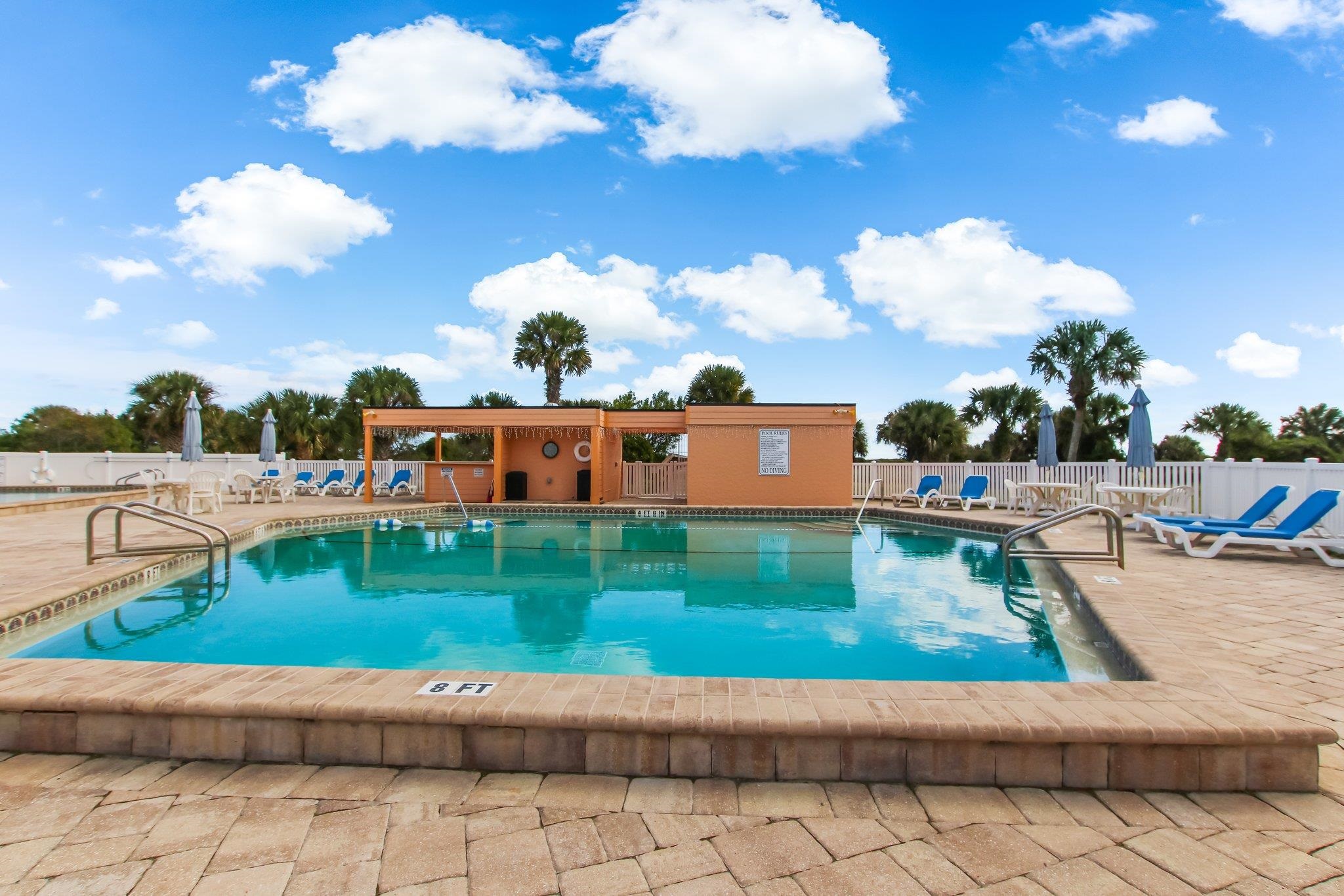 4 Ocean Trace Road, Unit 108 St. Augustine, FL 32080 - Photo 37 of 54 a front view of a house with garden