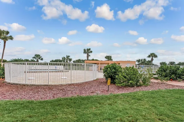 a view of a road from a backyard of a house