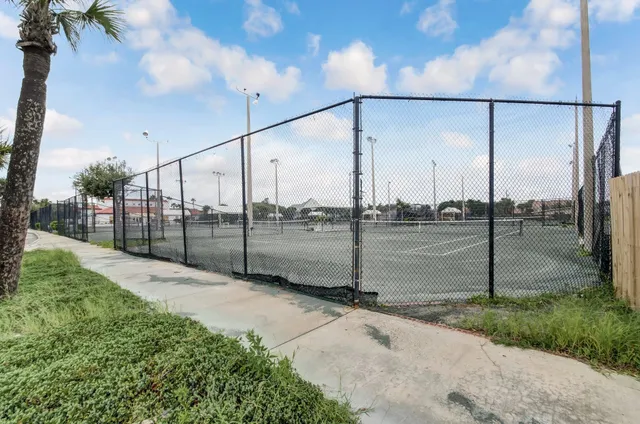 a view of a pathway with a building in the background