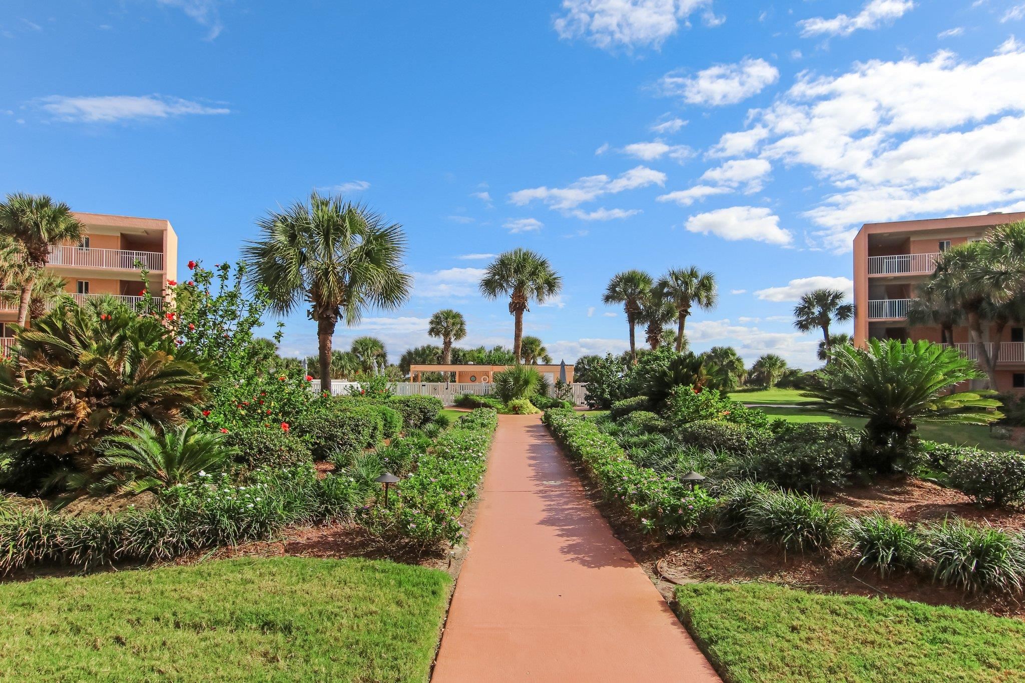 4 Ocean Trace Road, Unit 108 St. Augustine, FL 32080 - Photo 41 of 54 a view of a pathway with a building in the background