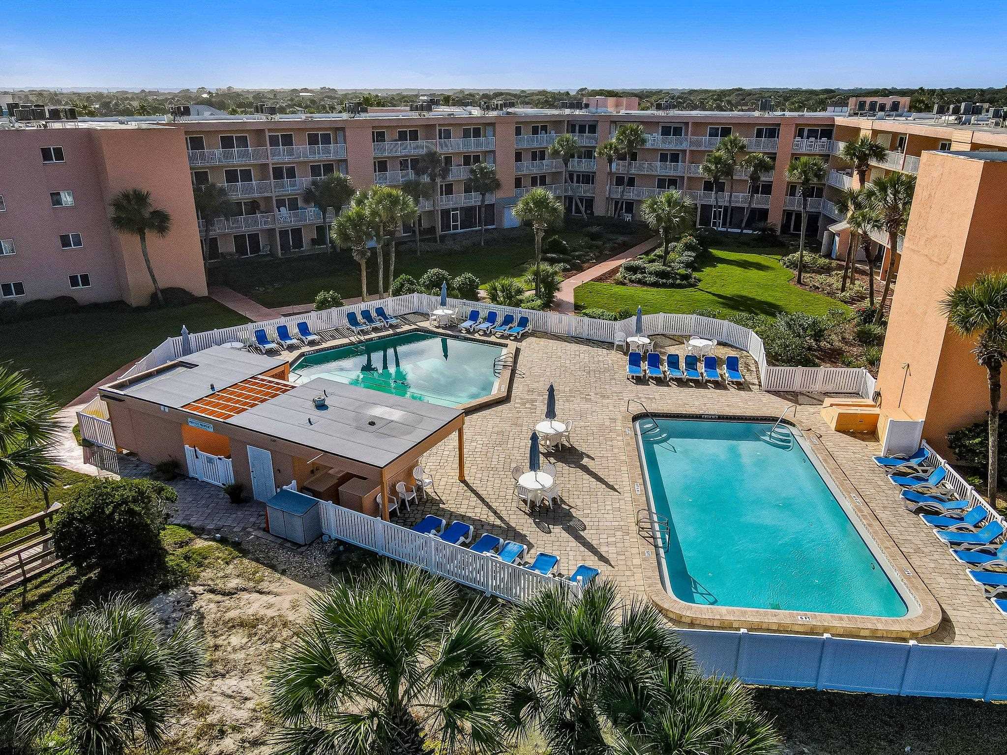 4 Ocean Trace Road, Unit 108 St. Augustine, FL 32080 - Photo 49 of 54 an aerial view of a tennis ground and a cars parked