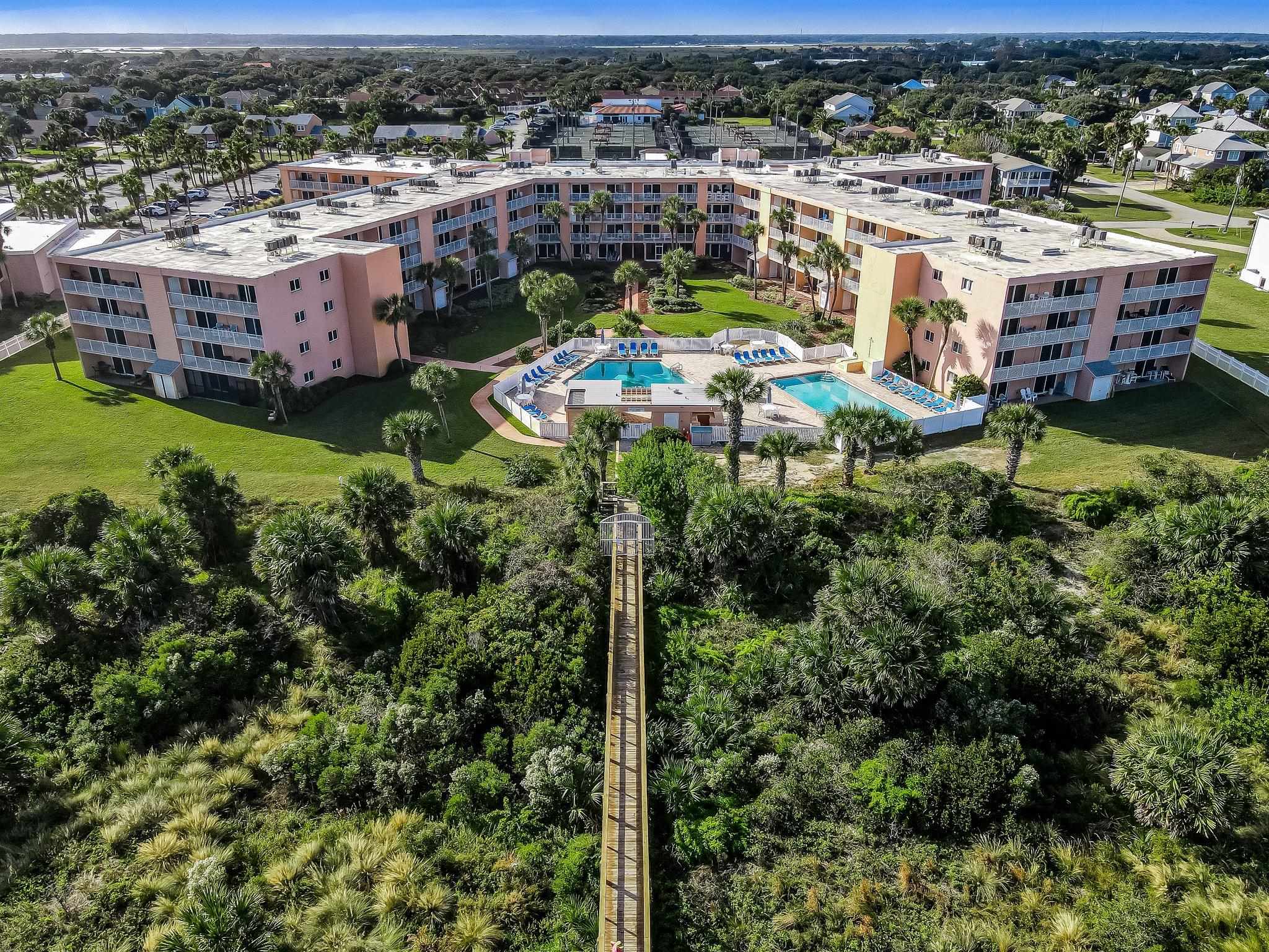 4 Ocean Trace Road, Unit 108 St. Augustine, FL 32080 - Photo 52 of 54 an aerial view of residential houses with yard and lake view