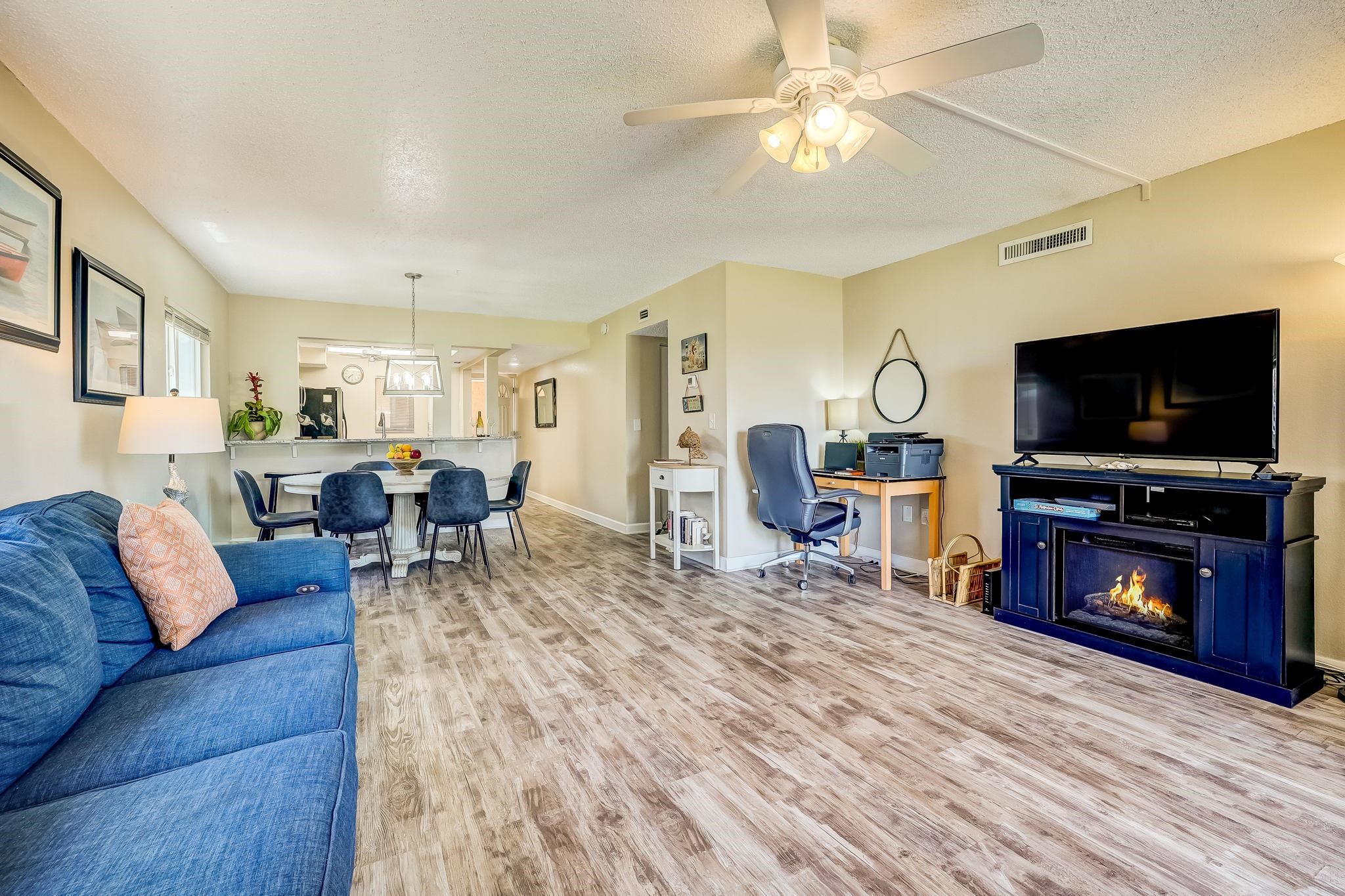 4 Ocean Trace Road, Unit 108 St. Augustine, FL 32080 - Photo 8 of 54 a living room with furniture and a flat screen tv