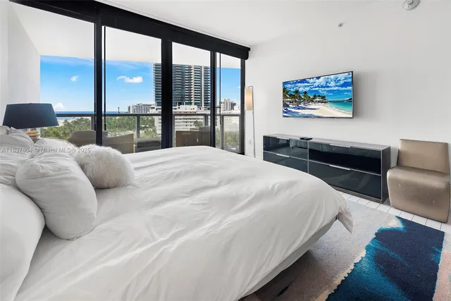 a bedroom with a large bed and a couch