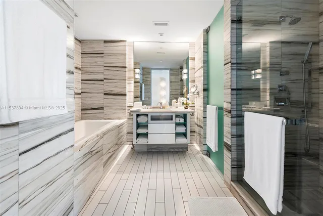 a bathroom with a bathtub and a sink