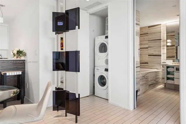 a view of a livingroom with wooden floor and furniture