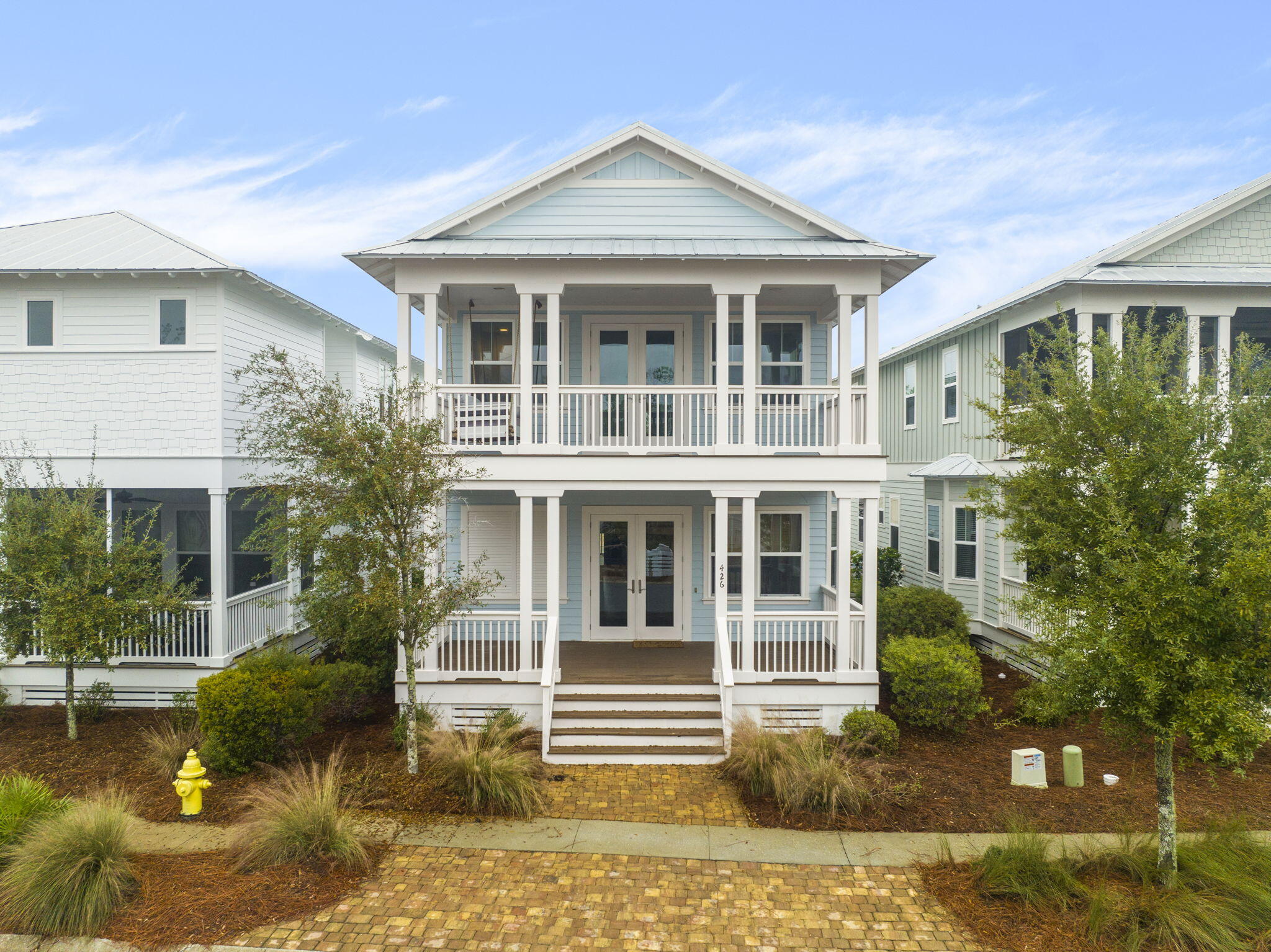 a front view of a house with garden