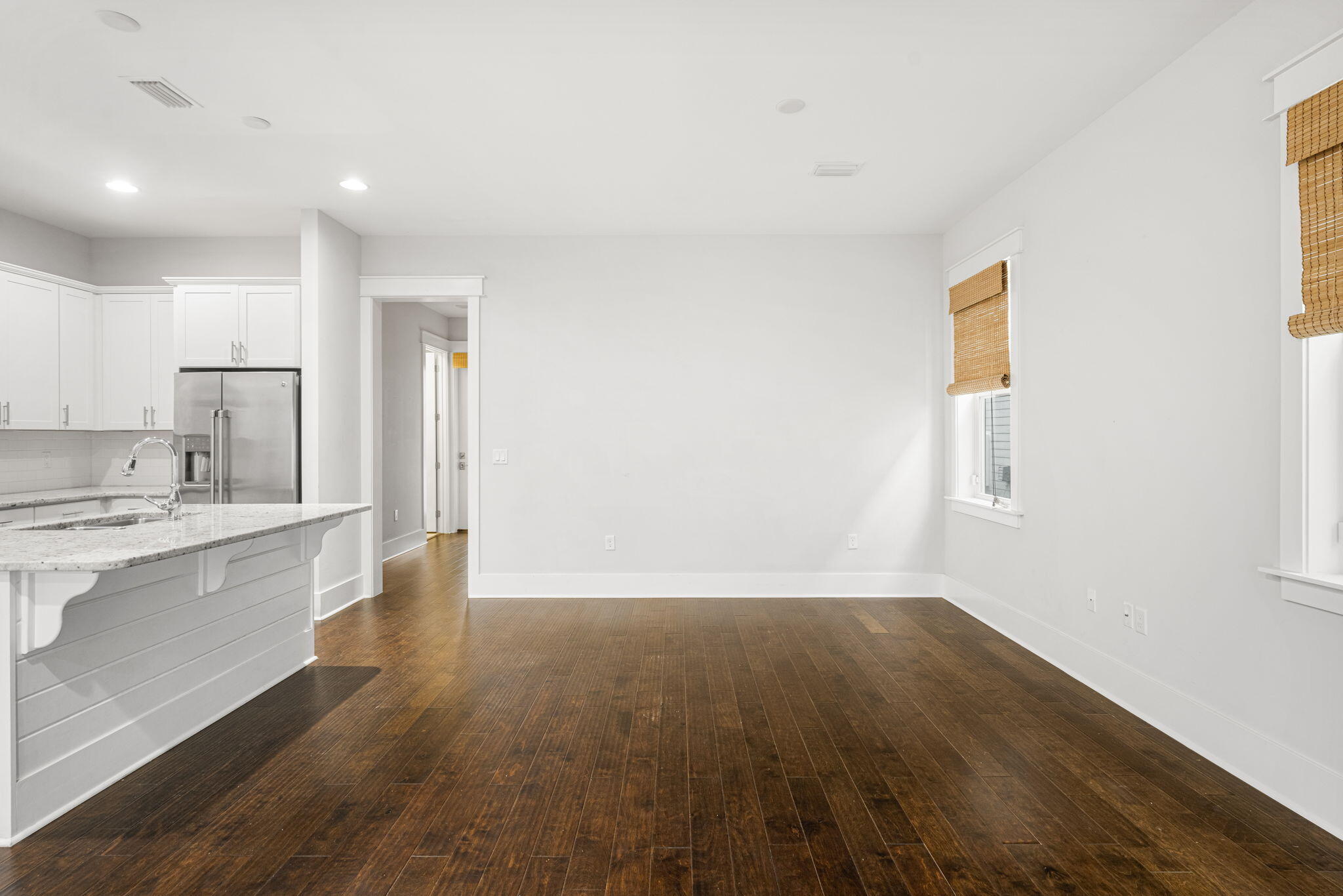 426 Flatwoods Forest Loop Santa Rosa Beach, FL 32459 - Photo 11 of 59 a view of a kitchen with wooden floor and a sink