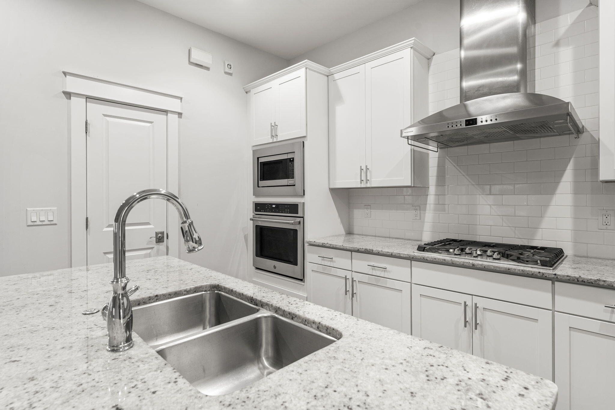 426 Flatwoods Forest Loop Santa Rosa Beach, FL 32459 - Photo 15 of 59 a kitchen with granite countertop a sink stove and cabinets