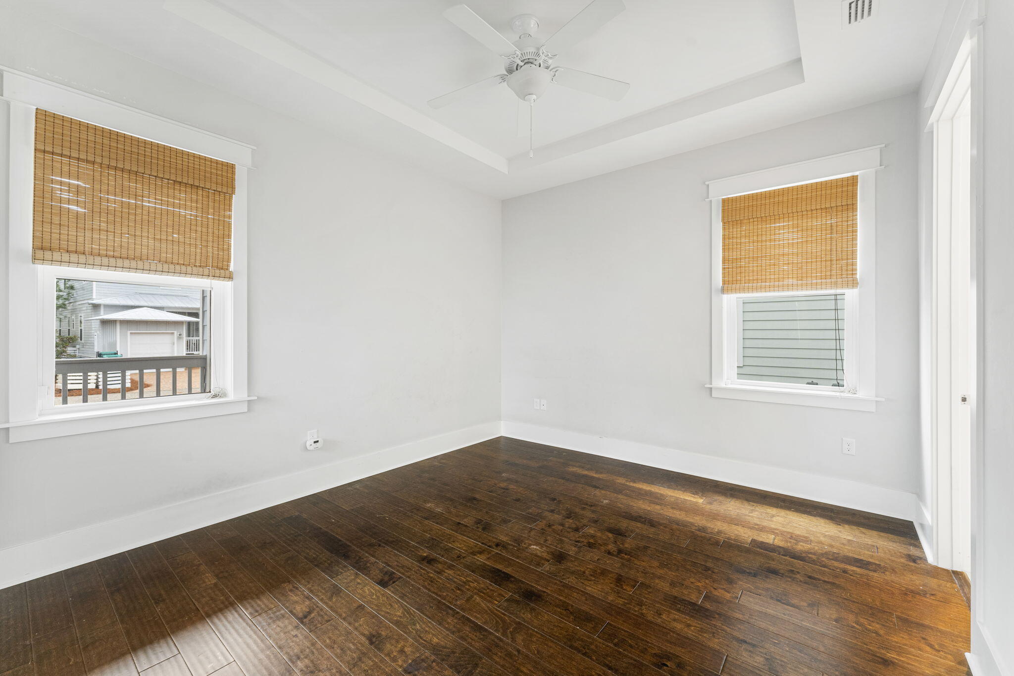 426 Flatwoods Forest Loop Santa Rosa Beach, FL 32459 - Photo 17 of 59 a view of an empty room with wooden floor and a window
