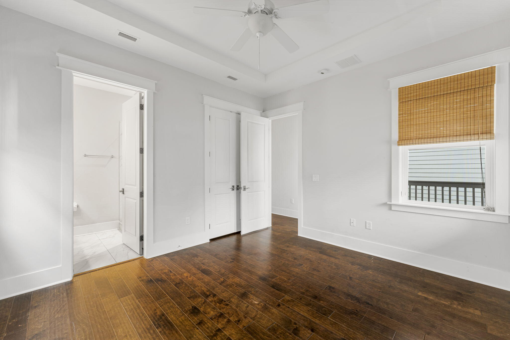 426 Flatwoods Forest Loop Santa Rosa Beach, FL 32459 - Photo 18 of 59 a view of an empty room with wooden floor and a window