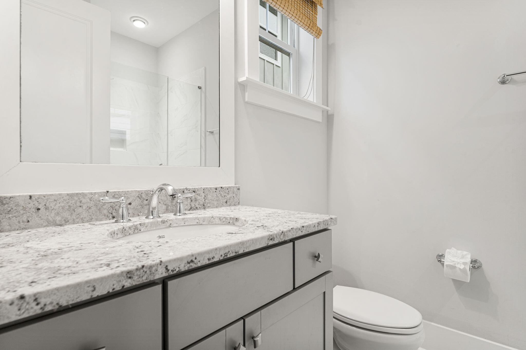 426 Flatwoods Forest Loop Santa Rosa Beach, FL 32459 - Photo 19 of 59 a bathroom with a granite countertop sink a toilet and a mirror