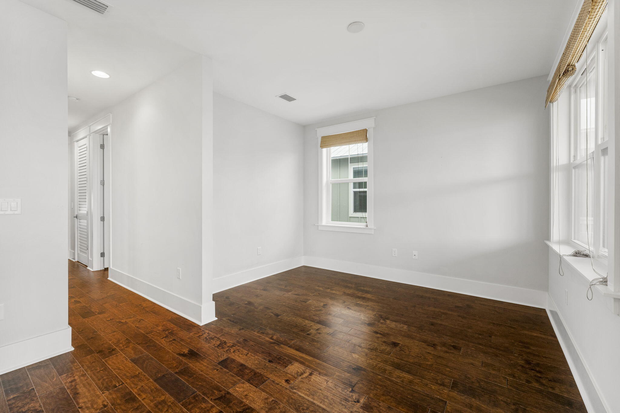 426 Flatwoods Forest Loop Santa Rosa Beach, FL 32459 - Photo 24 of 59 an empty room with wooden floor and windows