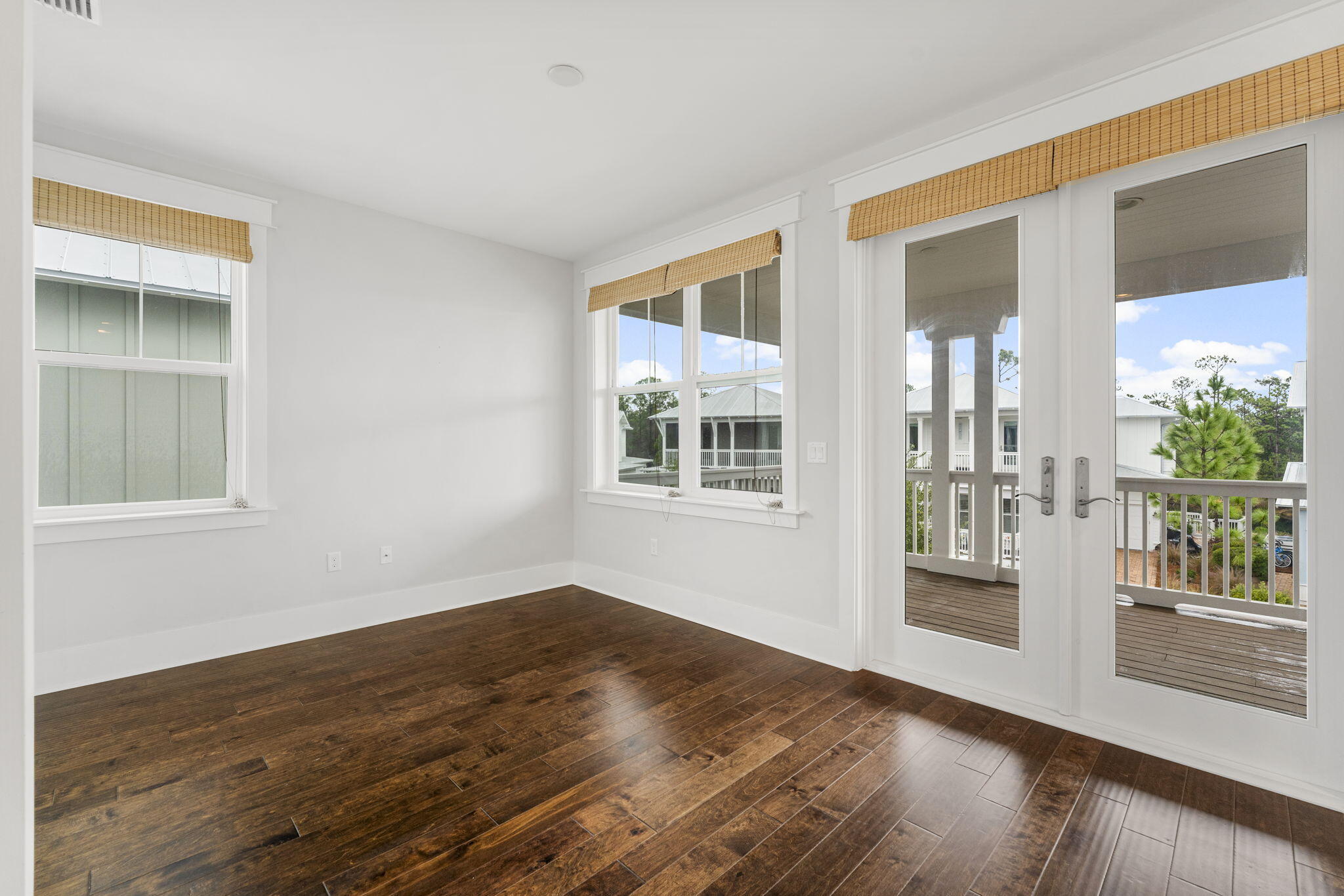 426 Flatwoods Forest Loop Santa Rosa Beach, FL 32459 - Photo 25 of 59 a view of empty room with wooden floor and fan