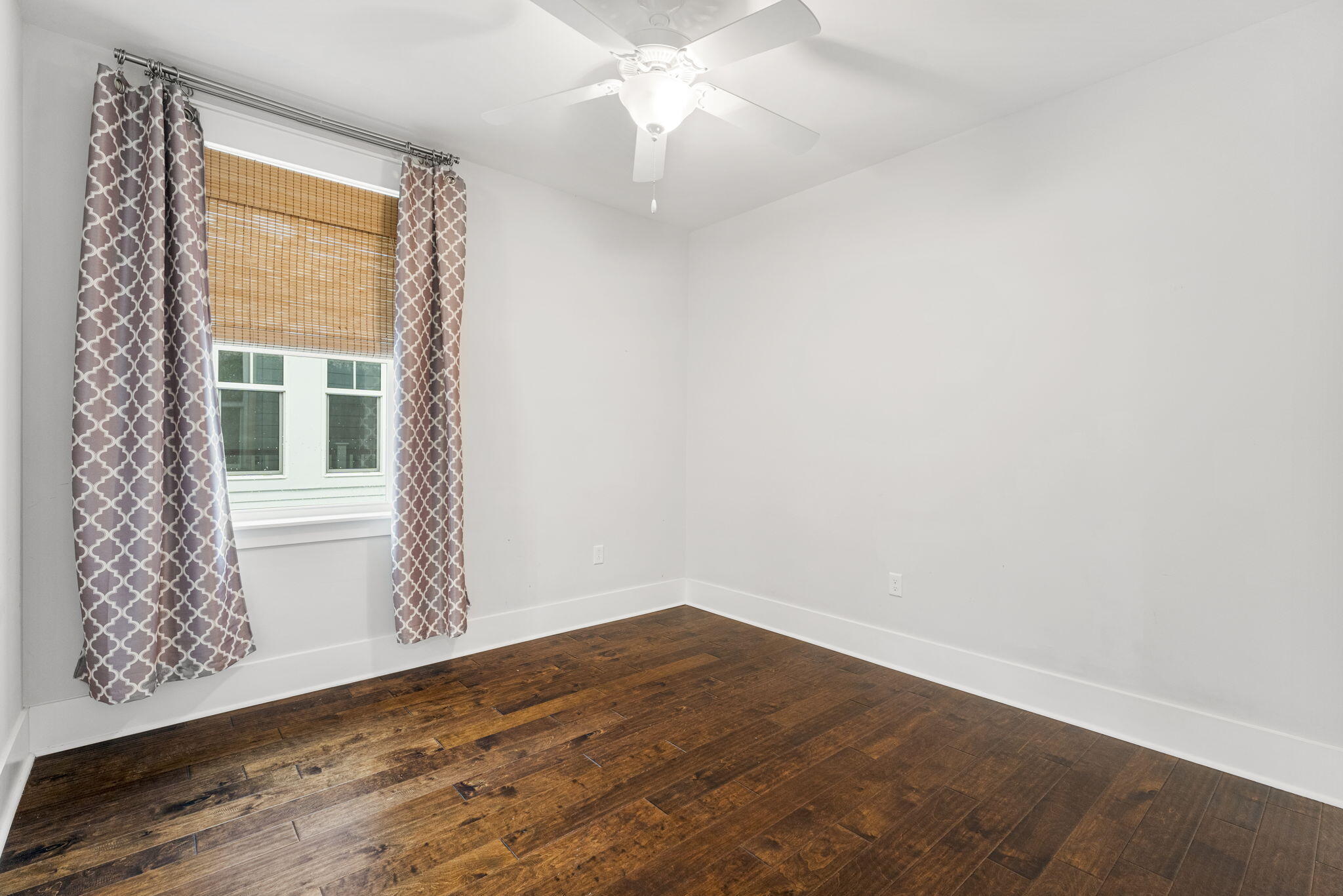 426 Flatwoods Forest Loop Santa Rosa Beach, FL 32459 - Photo 27 of 59 an empty room with a window and a ceiling fan